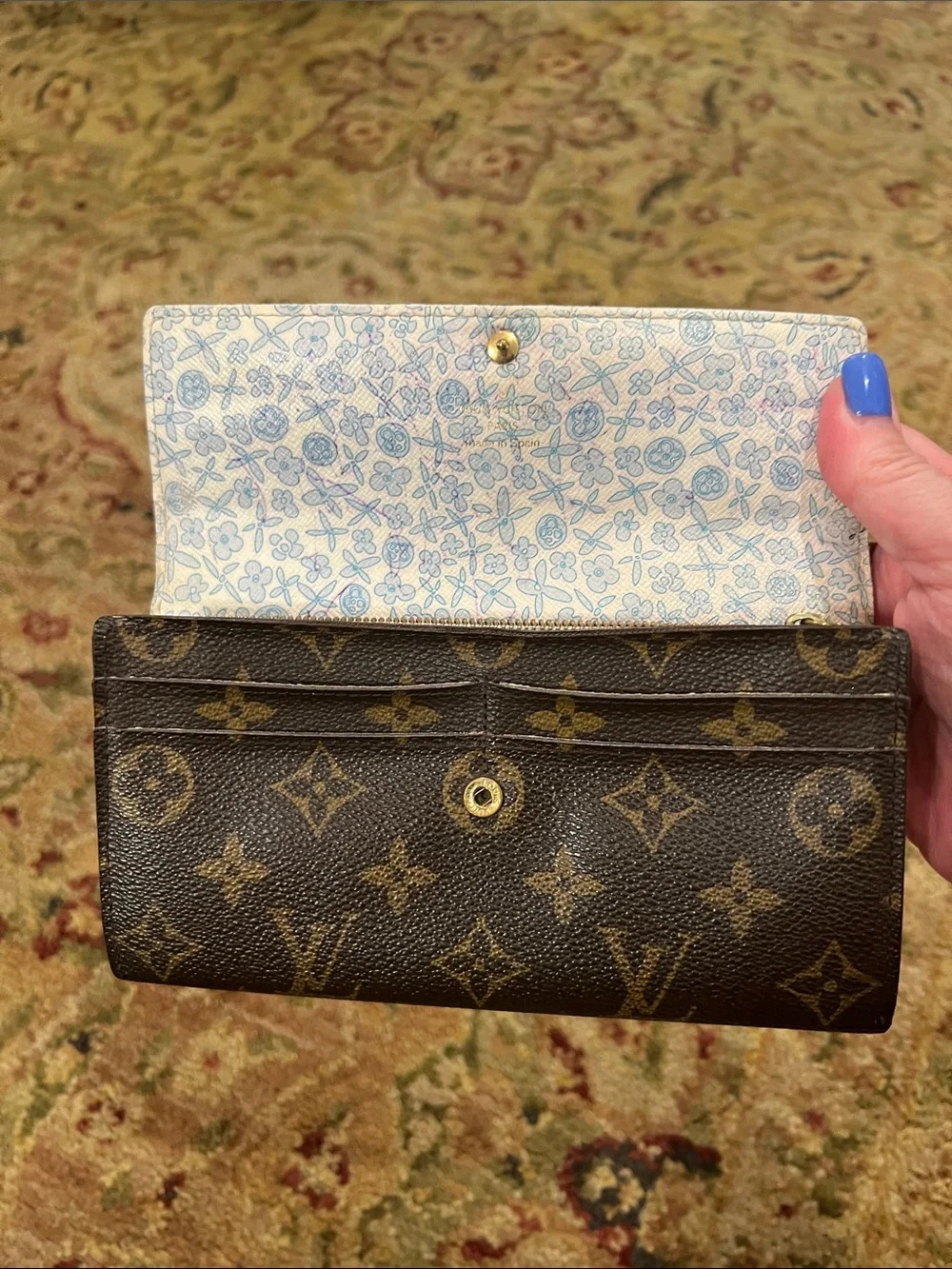 Louis Vuitton Monogram Sara wallet in Brown and Tan with blue floral interior